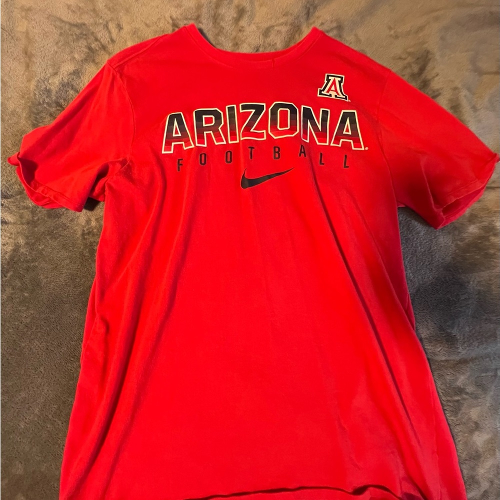 U OF A football shirt.